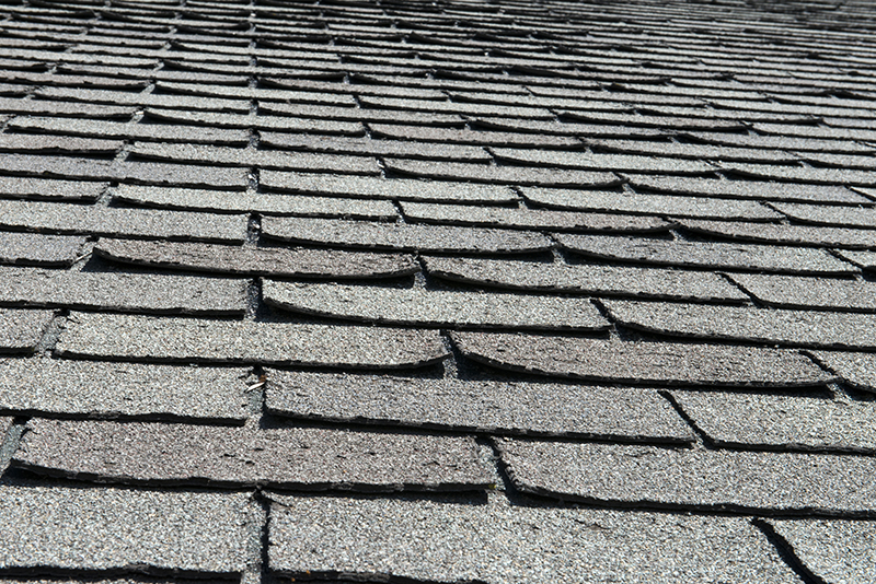 roof shingle edges start to curl